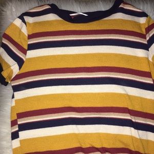 multi colored , stripped shirt .